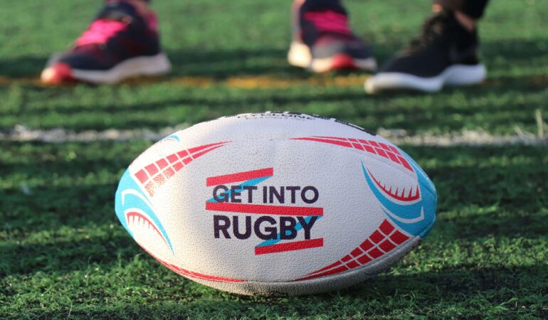 rugby-ball-in-a-field-in-middle-of-frame